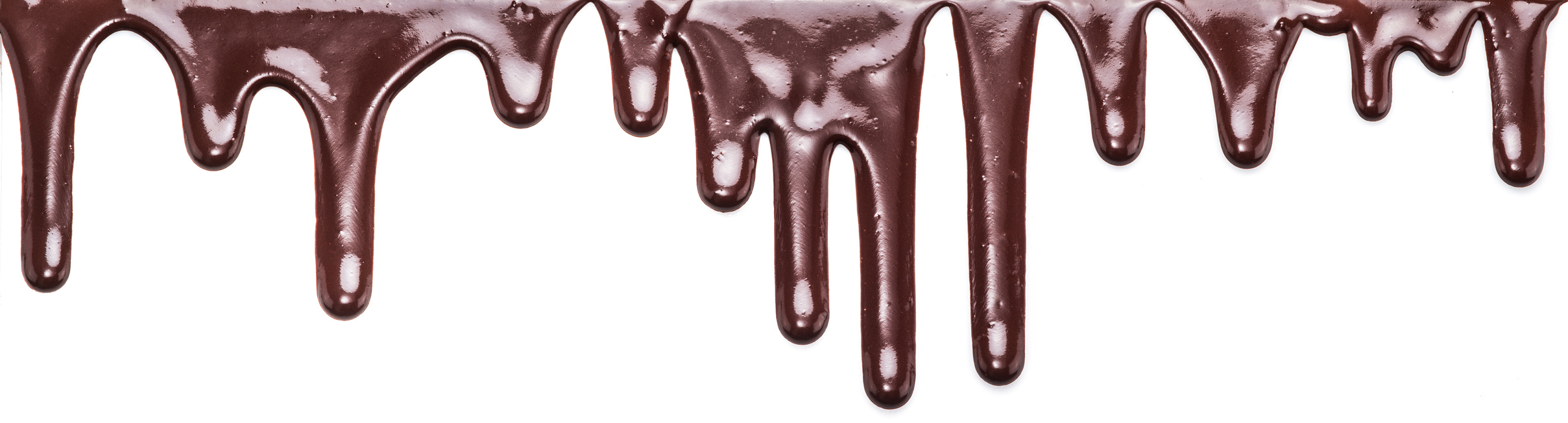 Flowing chocolate drops or drops of chocolate glaze.
